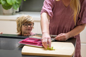 Child looking at Mum packing lunch in a Stainless Bento Lunchbox