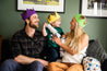A family laugh together while wearing caliwoods reusable party hats
