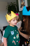 A young boy wears a caliwoods reusable party hat