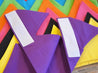 A close up of the velcro close of caliwoods reusable party hats 