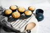 CaliWoods Reusable Muffin Cups filled with baking and on a tray 