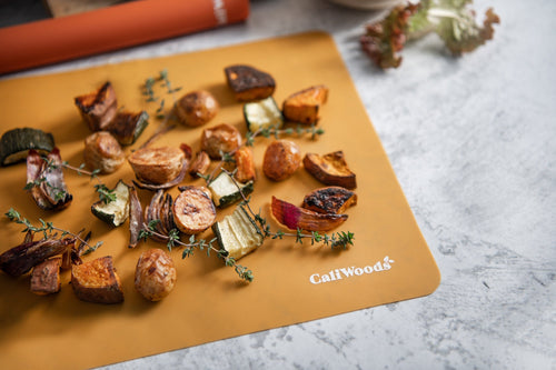 Roast vegetables on the orange Reusable Baking Mat 