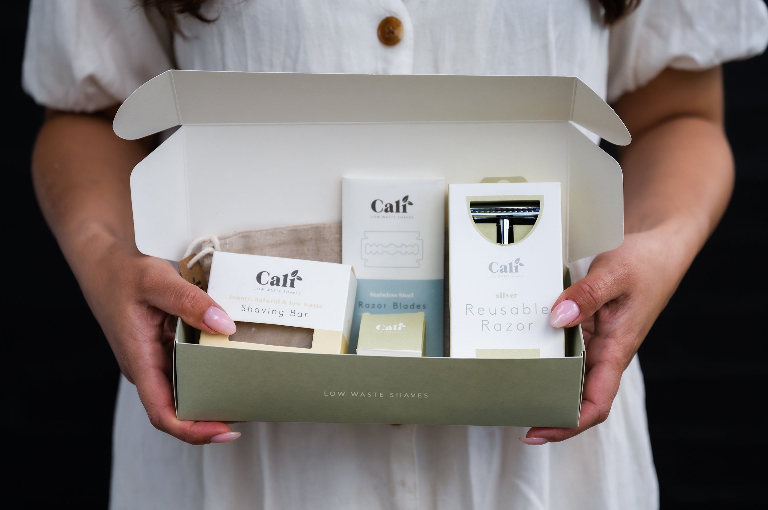 CaliWoods Safety Razor Shaving Kit in a Gift Box held in hands