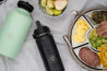 Black Dawny stainless steel drink bottle with food platter