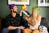 family with reusable Christmas Cracker, reusable party hats, and a refillable cotton gift bag