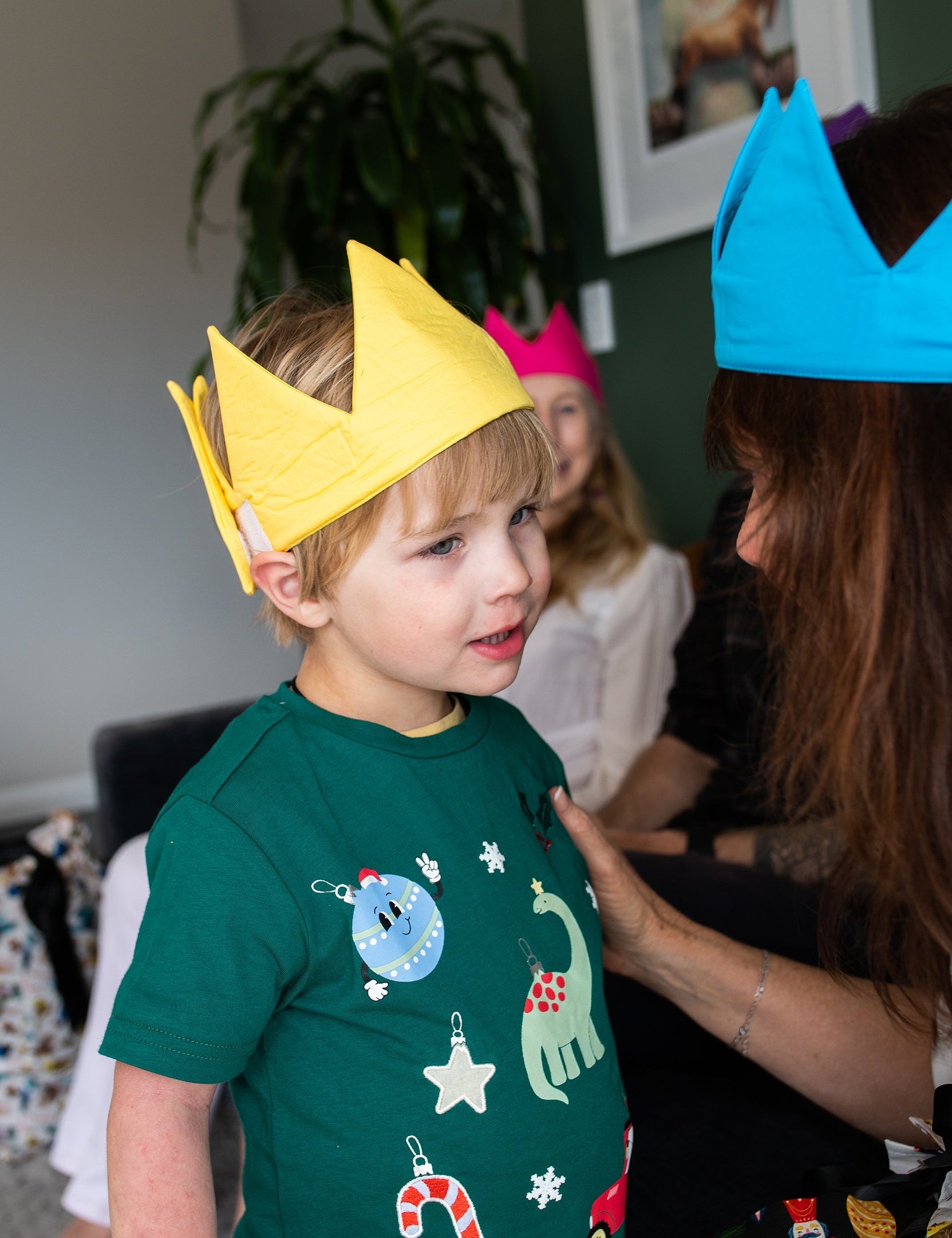 A young boy wears a yellow caliwoods reusable party hat